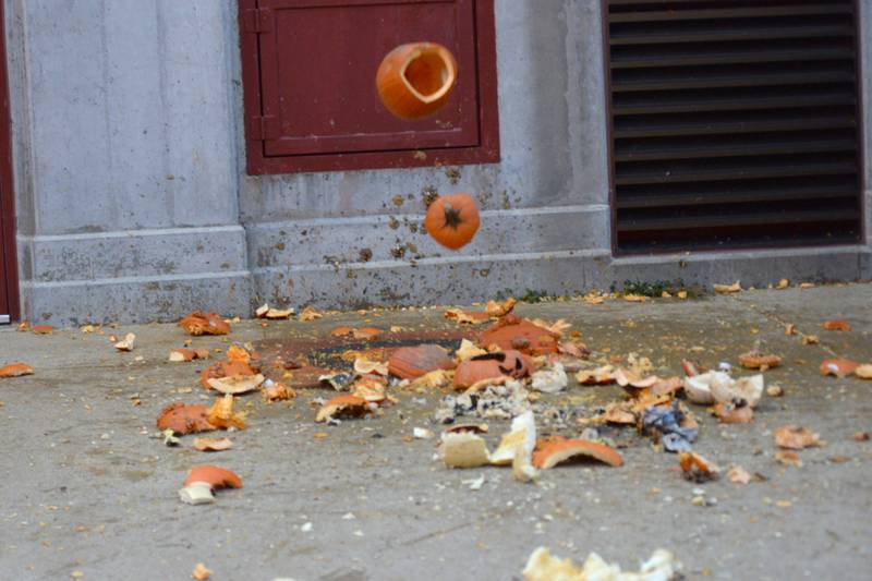 A Jack-O-Lantern flips its lid as it heads toward the bullseye during the Byron Fire Department's annual Pumpkin Smashing Event on Wednesday, Nov. 1, 2023.