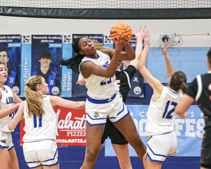 Lyon's Nora Ezike (25) grabs a rebound during their Coach Kipp's Hoopfest basketball game between Lyons at St Charles East. Jan 18, 2025 in La Grange.