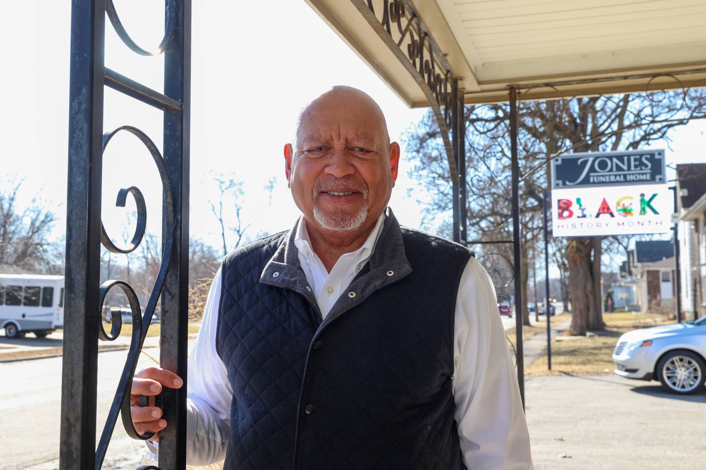 Jeff Jones stands outside the Jones Funeral Home in Kankakee on Feb. 18, 2026. Jones took over the business after his father, Thomas J. Jones, Jr., who commissioned the wrought iron details along the building's entry from a local business on Schuyler Avenue.