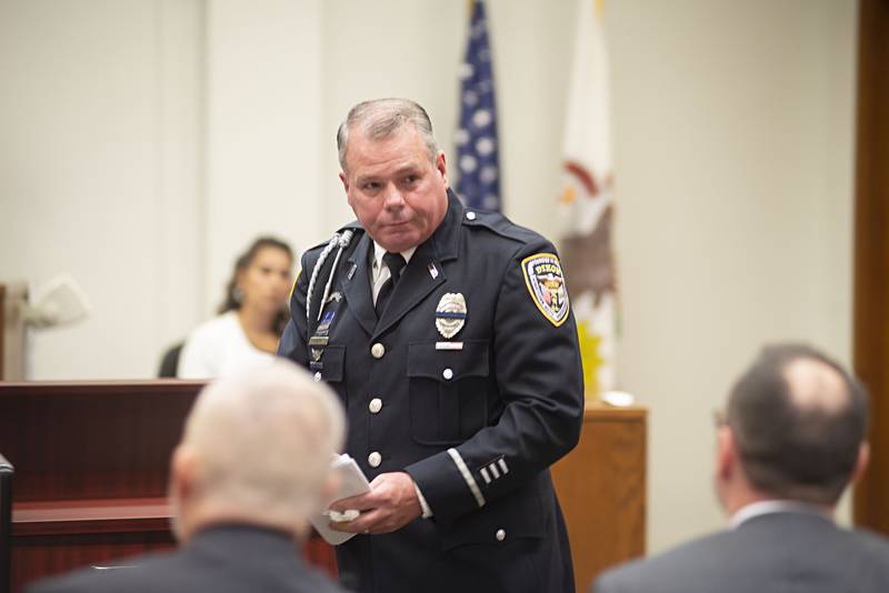 Former DHS school resource officer Mark Dallas leaves the stand after making a statement at the sentencing of Dixon High School shooter Matthew Milby.