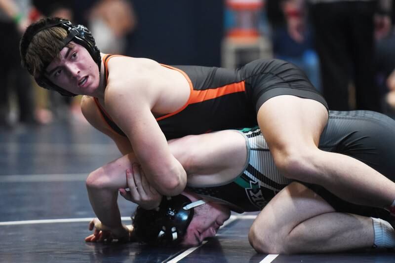 St. Charles East’s Brody Murray, top, and York’s Danny Decristofaro compete in the 175-pound final during the Class 3A Conant wrestling sectional on Saturday, Feb. 10, 2024 in Hoffman Estates.