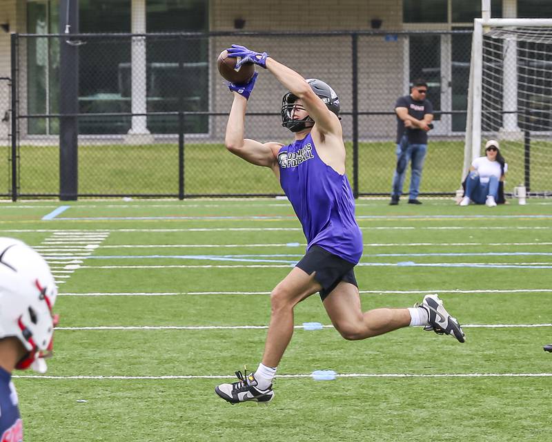 Downers Grove North's Joey Serpico makes a catch across the middle during the Downers Grove South 7 on 7 football tournament, July 12, 2025  in Downers Grove.