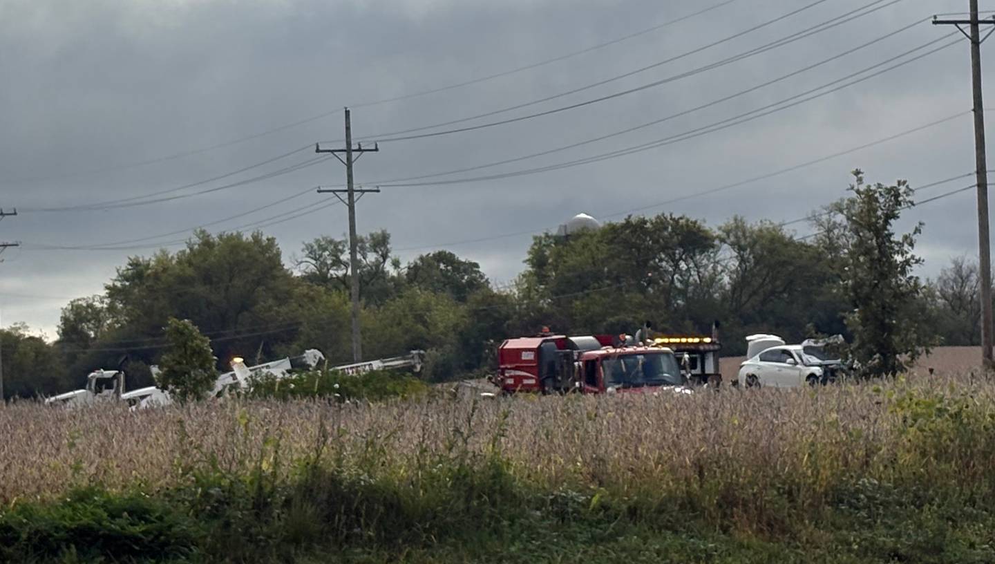 Crews work the scene of a crash that caused a truck to overturn and spill its load on Sept. 24, 2025, along Route 176, causing the road to shut down.