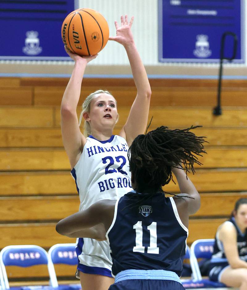 Hinckley-Big Rock's Anna Herrmann shoots over Illinois Math and Science Academy's Cheluchi Chuke during their game Thursday, Jan. 8, 2025, at Hinckley-Big Rock High School.