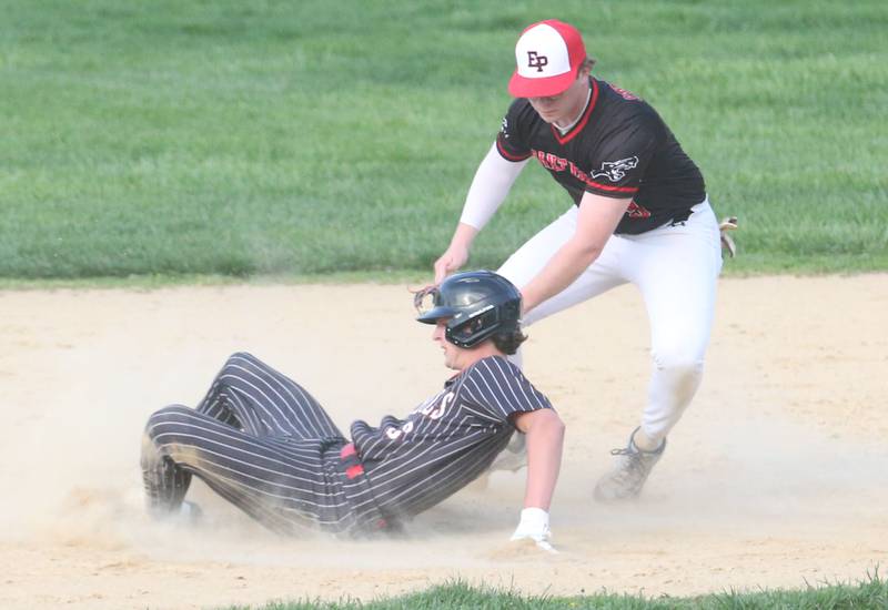 Hall's Jack Jablonski is tagged out attempting to steal second base by Erie-Prophetstown's Braylon Swertfeger on Monday, April 28, 2025 in Foley Field at Kirby Park in Spring Valley.