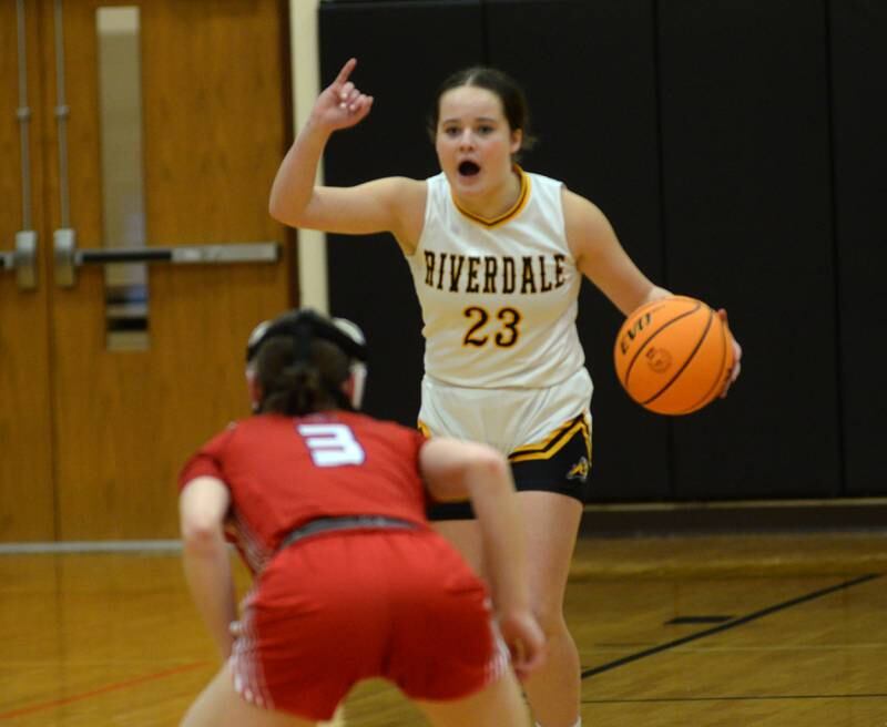 Riverdale's Jillian Murray (23) directs the offense as she brings the ball up the court against Oregon at the 2A Erie-Prophetstown Regional on Thursday, Feb. 20, 2025.