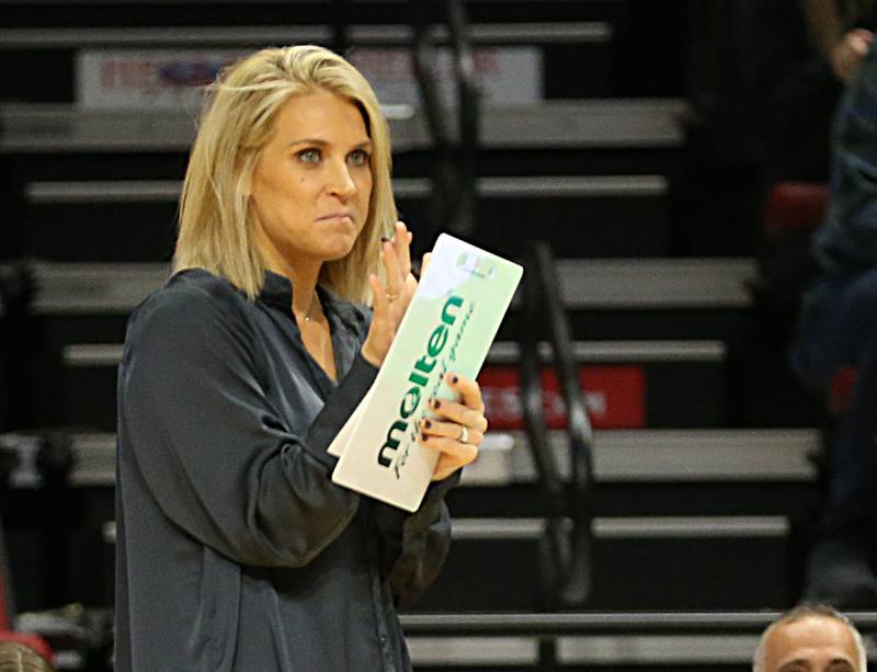 Nazareth Academy's head coach Melissa Masterson applauds her team while playing Taylorville in the Class 3A semifinal game on Friday, Nov. 11, 2022 at Redbird Arena in Normal.