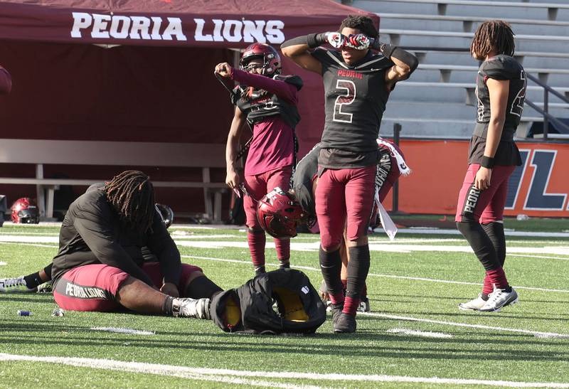 Peoria players are emotional after their IHSA Class 5A state championship loss to Nazareth  Saturday, Nov. 26, 2022, in Memorial Stadium at the University of Illinois in Champaign.