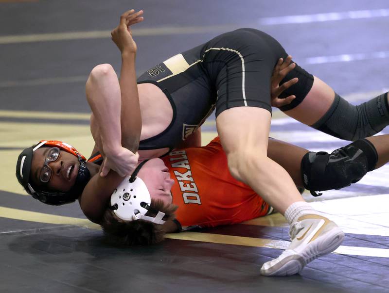 Sycamore’s Liam Schroeder tries to turn DeKalb’s Jaden Bradley during their 113 pound match Friday, Jan. 16, 2026, at Sycamore High School.