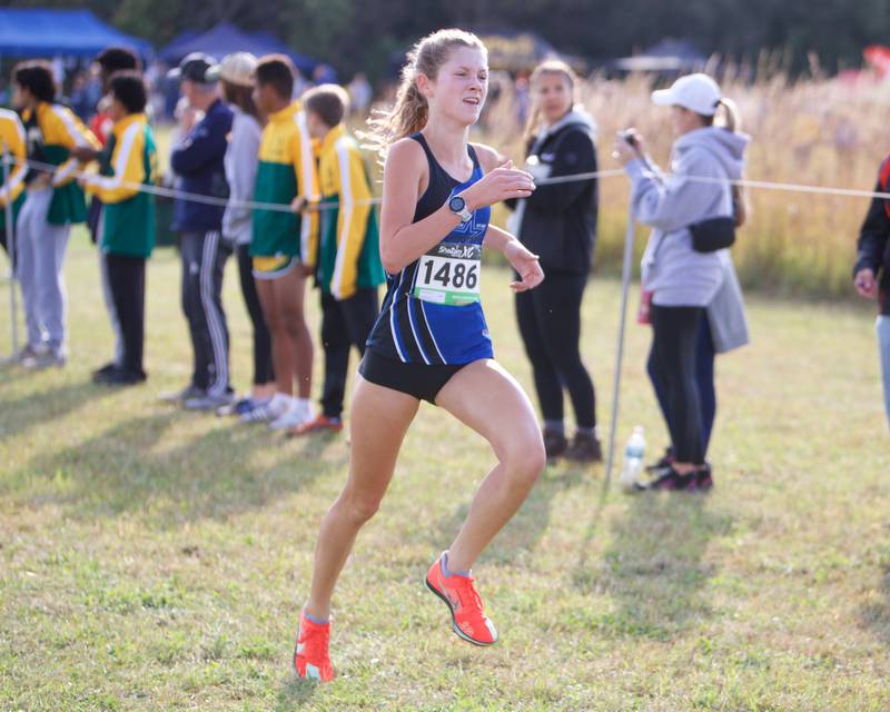 St. Charles North's Gwen Hobson heads for the finish line at the St. Charles North Cross Country Invitational on Saturday, Oct. 5,2024 AT LeRoy Oaks Forest Preserve in St. Charles.