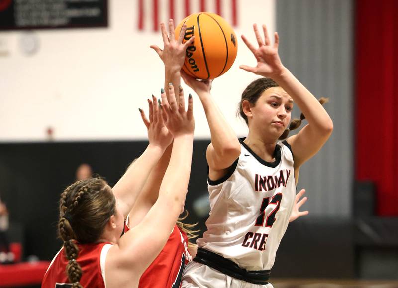 Indian Creek's Isabella Turner kicks the ball out among two Aurora Christian players during their game Monday, Nov. 25, 2024, at Indian Creek High School in Shabbona.