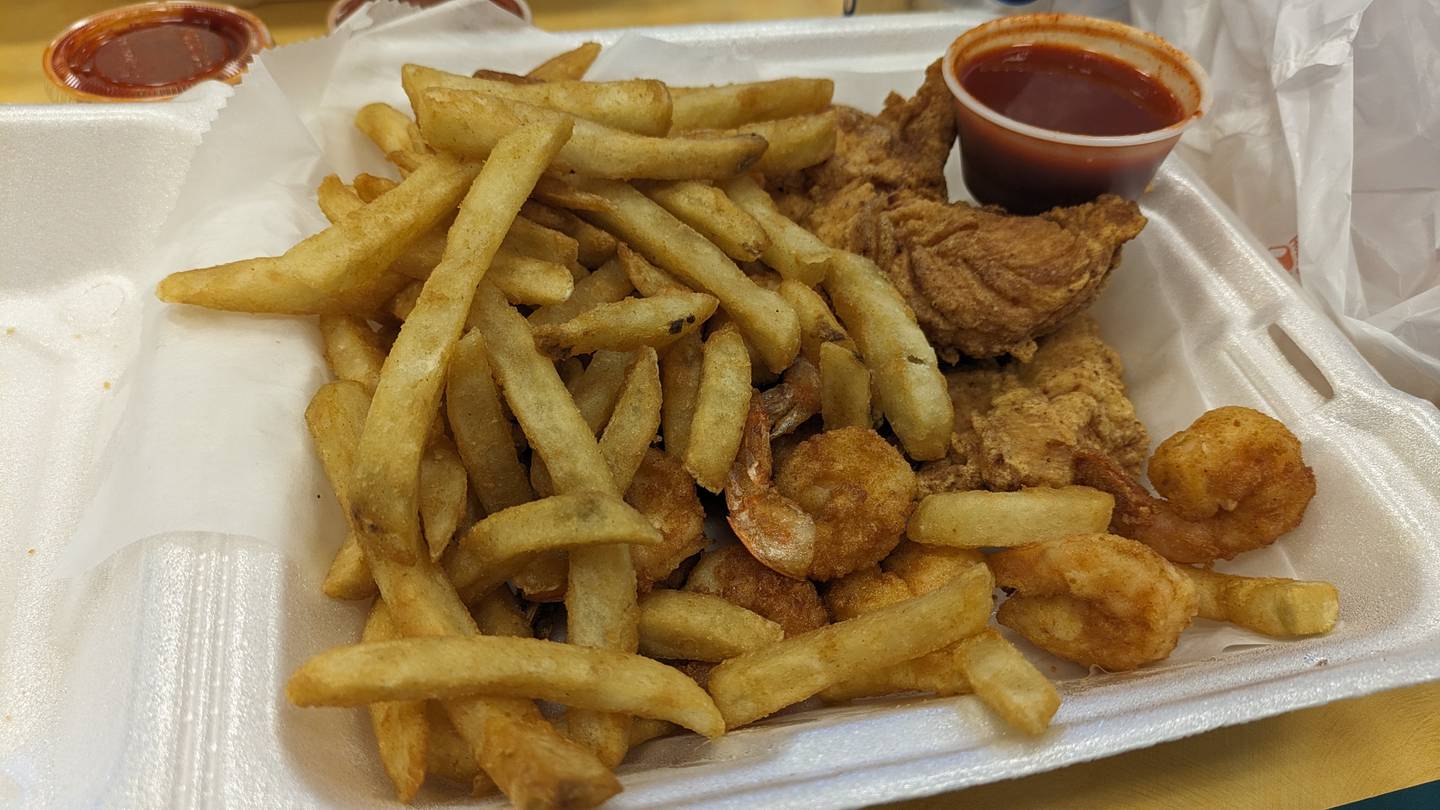 The two-item combo with chicken tenders and medium fried shrimp at Sam's Fish, Chicken & Sandwiches in DeKalb.