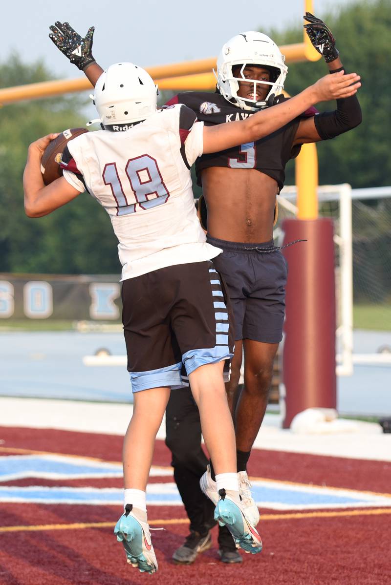 Kankakee's Cedric Terrell III, right, congratulates David Andrade on his touchdown during a scrimmage the the Kays' summer camp Thursday, July 31, 2025.
