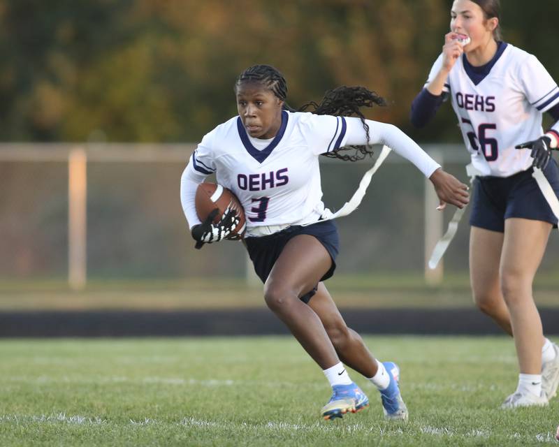 Oswego East's Avaya Kittling-turner (3) runs up the middle during Oswego East Regional Final flag football game between St. Charles North at Oswego East Thursday, Oct 9, 2025 in Oswego.