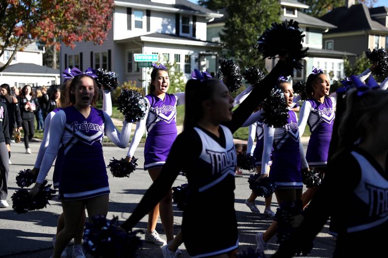 Downers Grove North cheerleaders march on Friday, Oct. 18, 2024 during the school’s annual homecoming parade.