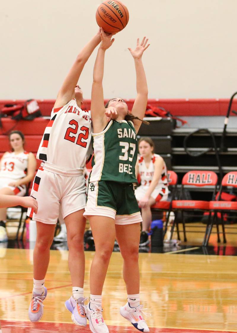 Hall's Kennedy Wozniak (22) beats St. Bede's Jenna Ladzinski (33) to a rebound on Monday, Nov. 28, 2022 at Hall High School in Spring Valley.