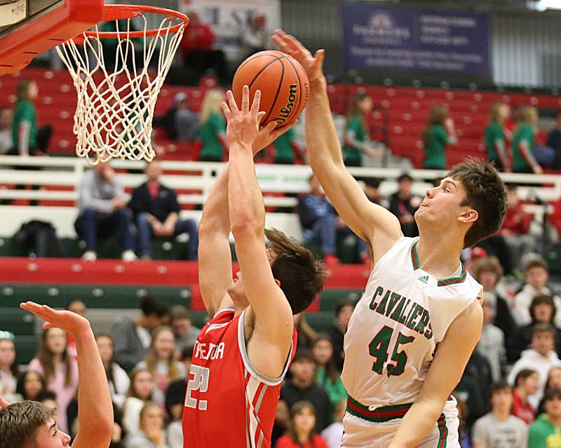 Streator's Christian Benning runs in the lane as L-P's Brendan Boudreau defends on Thursday, Jan. 28, 2023 at L-P High School.