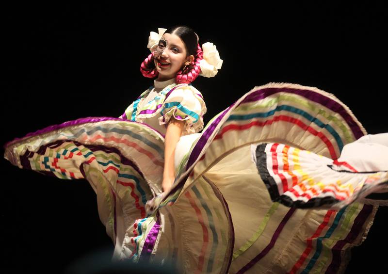 Victoria Casas, 14, of Round Lake performs with the Mexico en La Piel Folkloric Dancers during the Day of the Dead Celebration at the Round Lake Beach Cultural & Civic Center