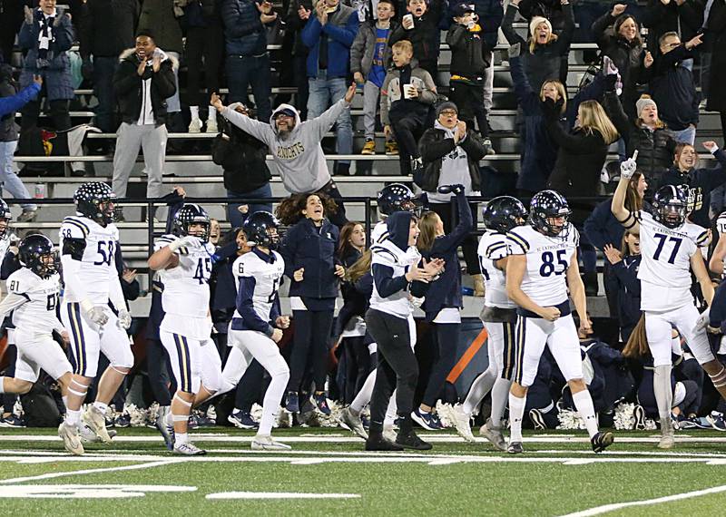 IC Catholic players and fans celebrate after scoring a touchdown against Williamsville in the Class 3A State title game on Friday, Nov. 25, 2022 at Memorial Stadium in Champaign.