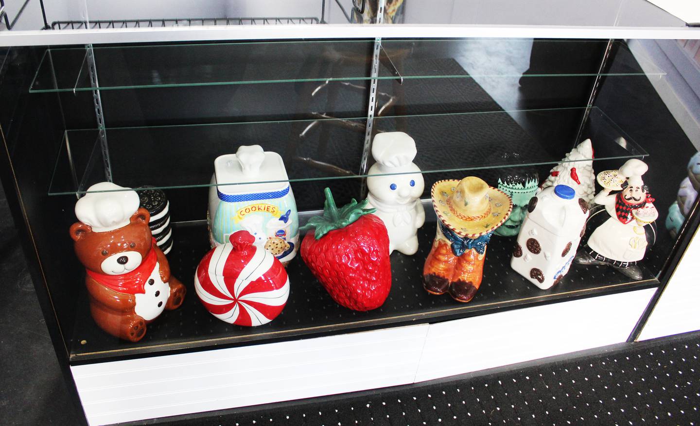 The Cookie Jar's space in downtown Amboy is decorated with ornate cookie jars, a small table and colorful displays of positivity art such as quotes, posters and affirmations.