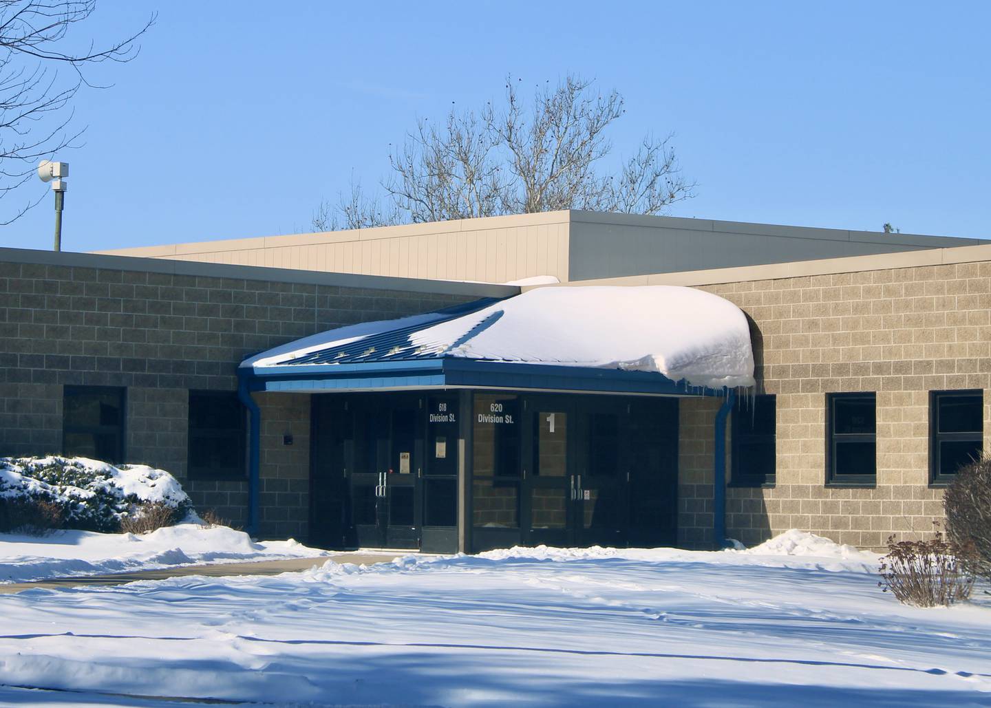 The Division Street entrance to Madison Elementary School, at left, and Reagan Middle School, at right, which will be upgraded and receive new directional signs for visitors.