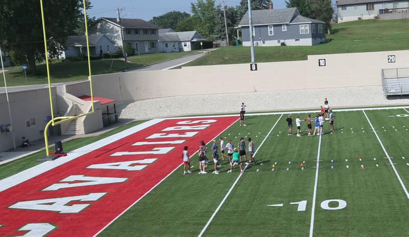 Players of the La Salle-Peru football team practice at Howard Fellows Stadium during their football camp on Tuesday, July 25, 2023 in Peru.