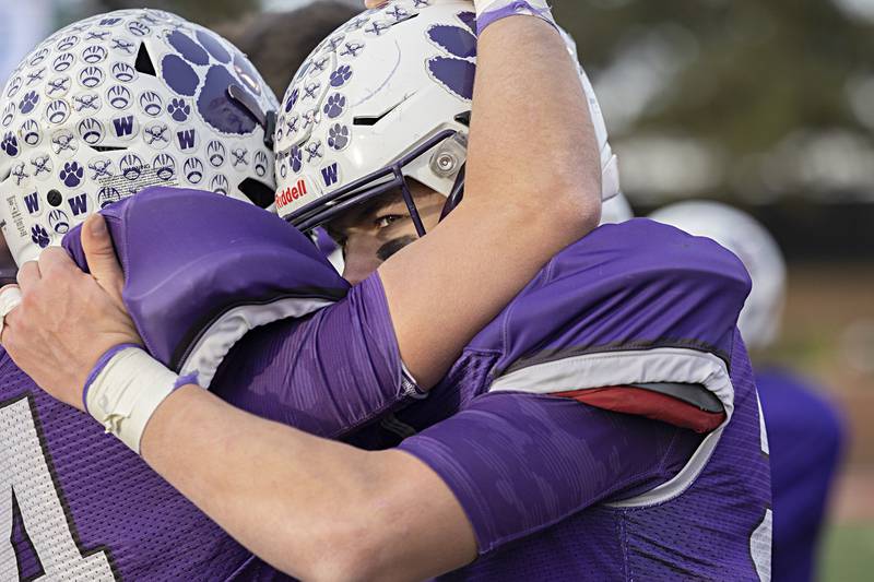 The Wilmington Wildcats celebrate their 28-3 win over Athens Friday, Nov. 24, 2023 in the 2A state football championship game at Hancock Stadium in Normal.