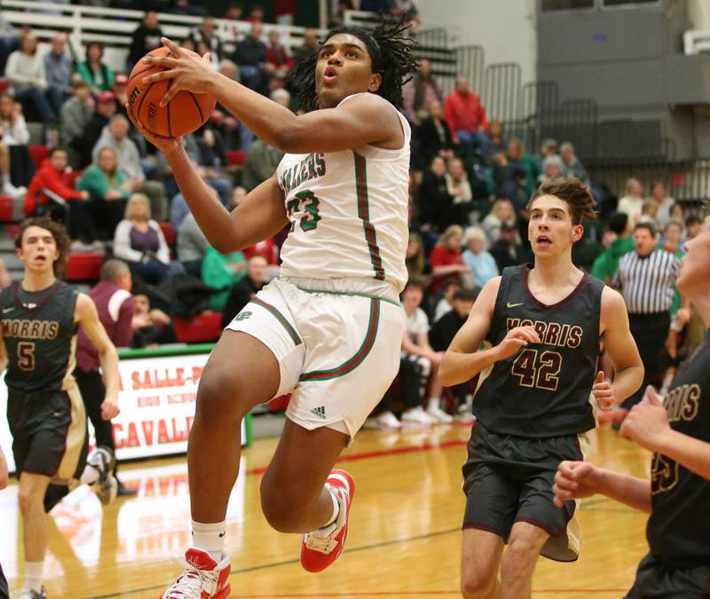 L-P's Maalik Madgrigal runs past Morris's Bennett Ammer to score on a drive to the basket in Sellett Gymnasium on Friday, Jan. 13, 2023 at L-P High School.