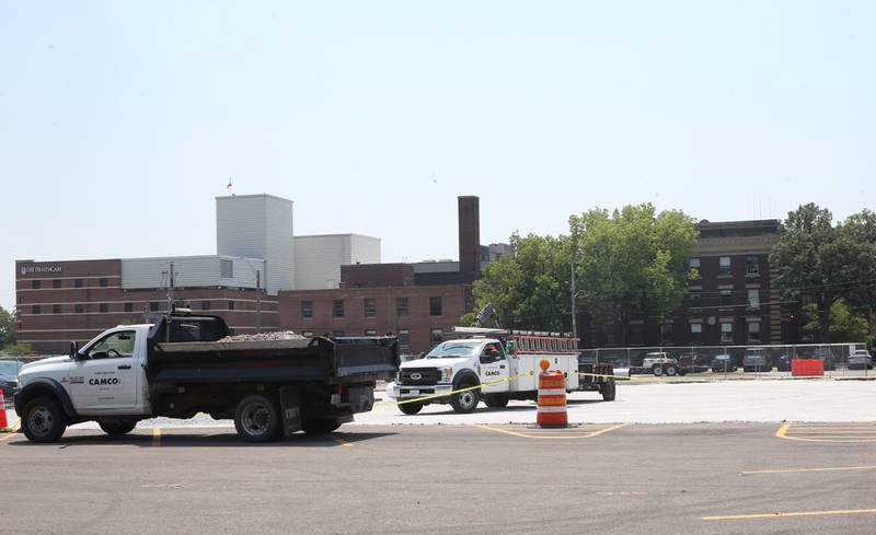 Crews from CAMCO Construction work on paving a lot at the corner of 7th and West Street on Monday, July 7, 2025 at OSF St. Elizabeth West Hospital in Peru.
