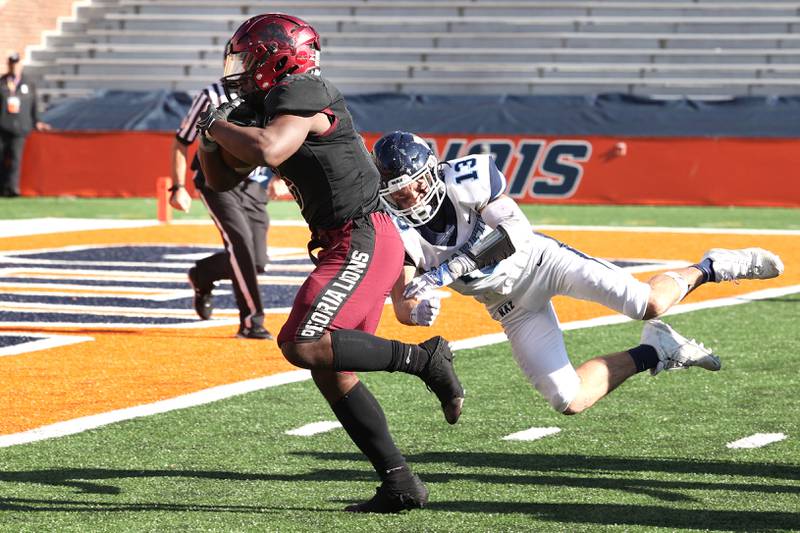 Peoria's Malachi Washington breaks free from Nazareth's Brady Gorman for a touchdown during their IHSA Class 5A state championship game Saturday, Nov. 26, 2022, in Memorial Stadium at the University of Illinois in Champaign.