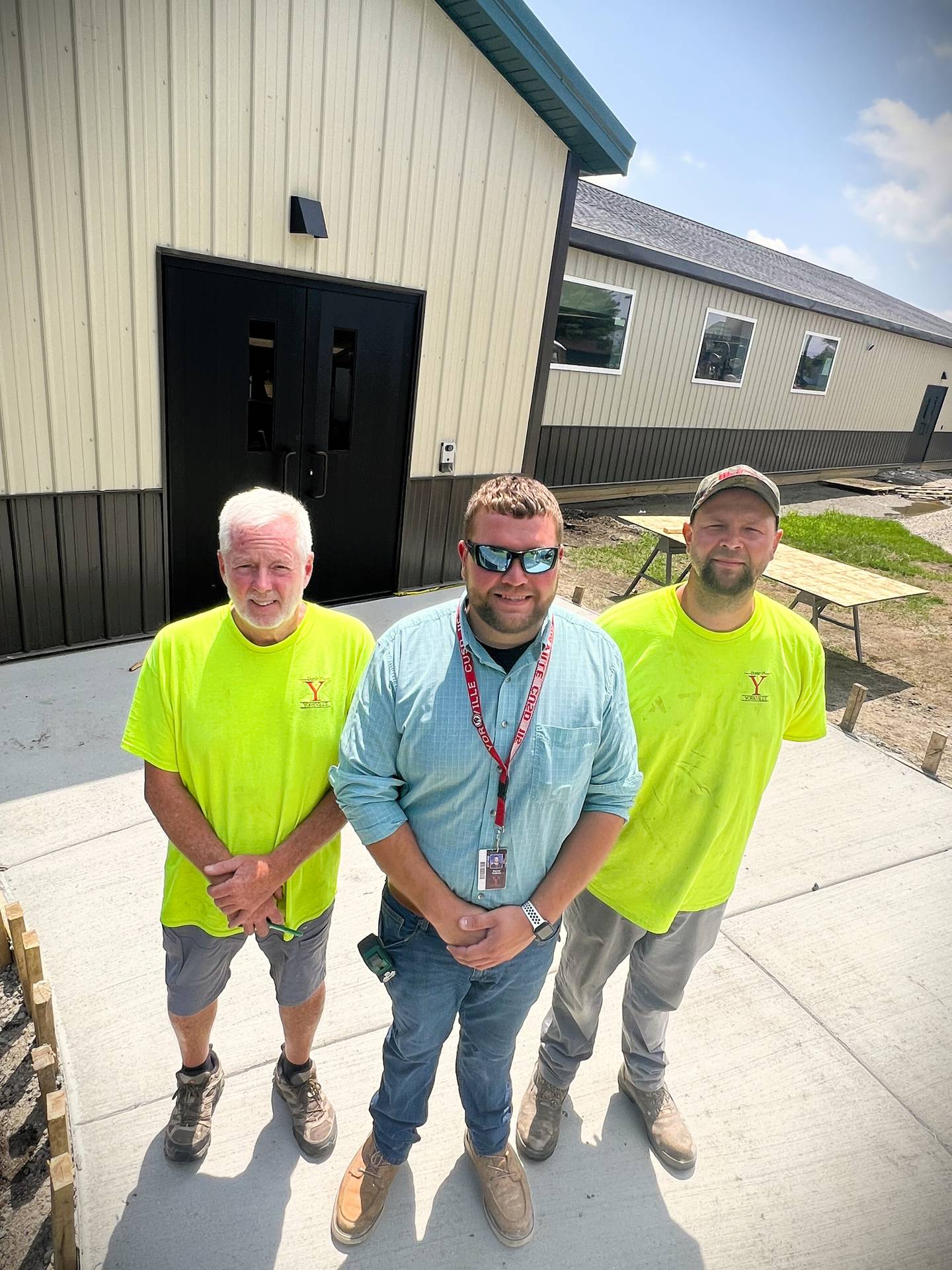 The Yorkville 115 team that oversaw the completion of the new temporary classroom structure at Grande Reserve Elementary School show off their accomplishment. Pictured, David Hill, maintenance supervisor, David Yodelis, director of facility operations, and Steve Yodelis, maintenance technician.