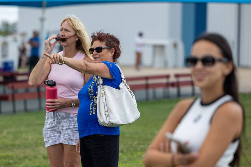 (from left) Amy Furchner and Brigid Hebert watch on as divers load plane before attempting the world record vertical formation on Wednesday, Aug 20, 2025 above Skydive Chicago in Ottawa.