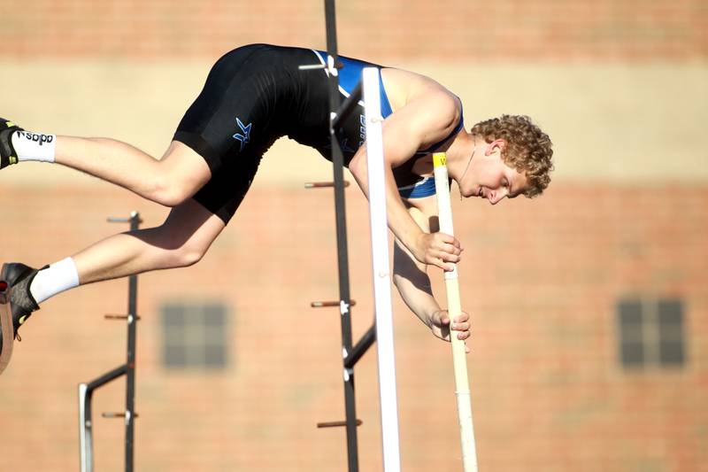 St. Charles North’s Bobby Guetthoff competes in the pole vault during the Kane County boys track and field championships on Friday, May 9, 2025 at St. Charles North.