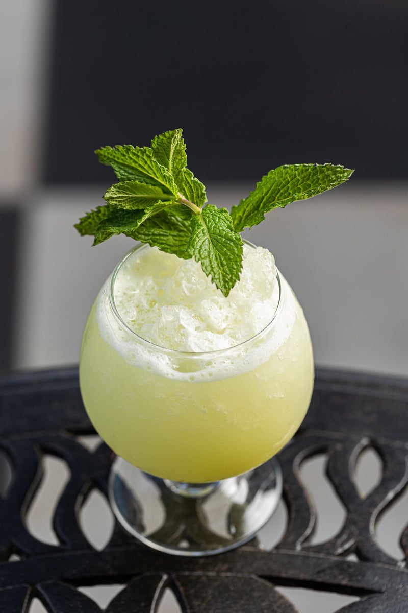 The Graceful Ordinary’s “Greener Pastures” sipper—  a vibrant cocktail mixed with Green Chartreuse, coconut, pineapple, and fresh lime juice.