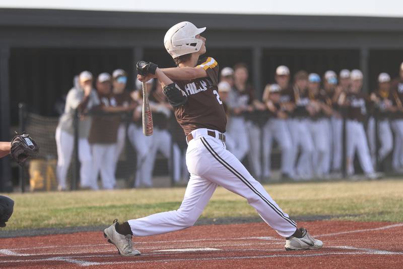 Joliet Catholic’s Johnny Curbis drives in a run against Lincoln-Way Central on Wednesday, March 25, 2026 in New Lenox.
