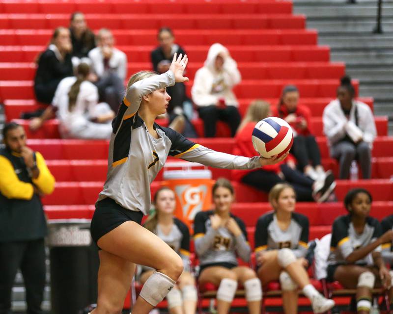 Joliet West's Lola Berta (7) serves during Class 4A Bolingbrook Sectional semifinal match between Joliet West at Oswego.  Nov 5, 2024  in Bolingbrook.