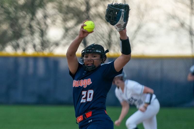 Oswego’s Jaelynn Anthony (20) delivers a pitch against Oswego East during a softball game at Oswego East High School on Wednesday, April 19, 2023.