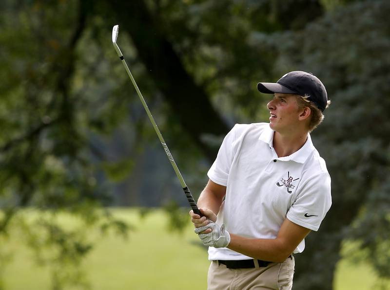 Prairie Ridge’s Charlie Pettrone watches his tee shot on the eighth hole during the Fox Valley Conference Boys Golf Tournament Thursday, Sept. 21, 2023, at McHenry Country Club in McHenry.