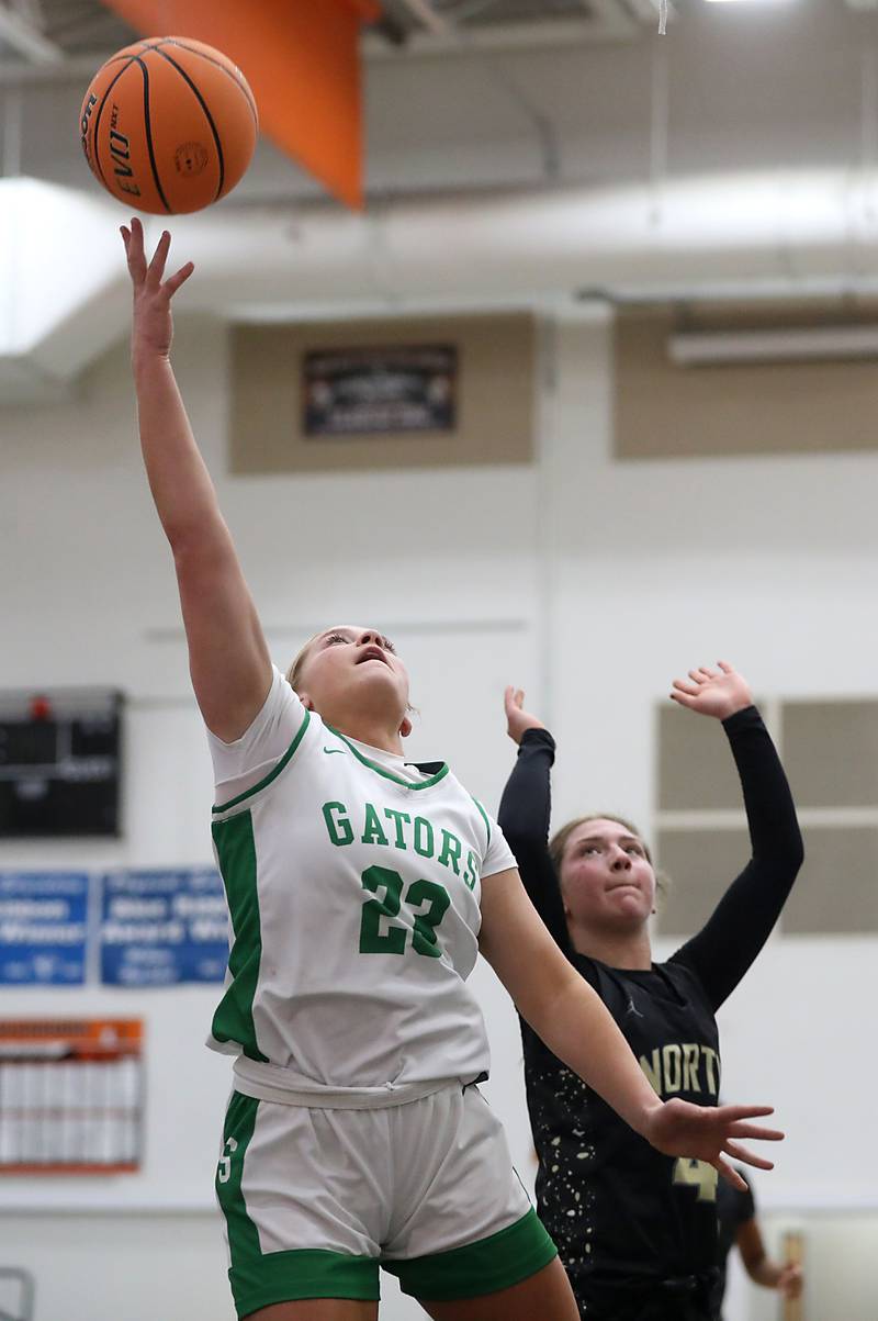 Crystal Lake South's Laken LePage shoots the ball in front of Grayslake North's Lucy Roscoe during a Northern Illinois Holiday Classic semifinal girl basketball game on Tuesday, Dec. 16, 2025, at McHenry High School.