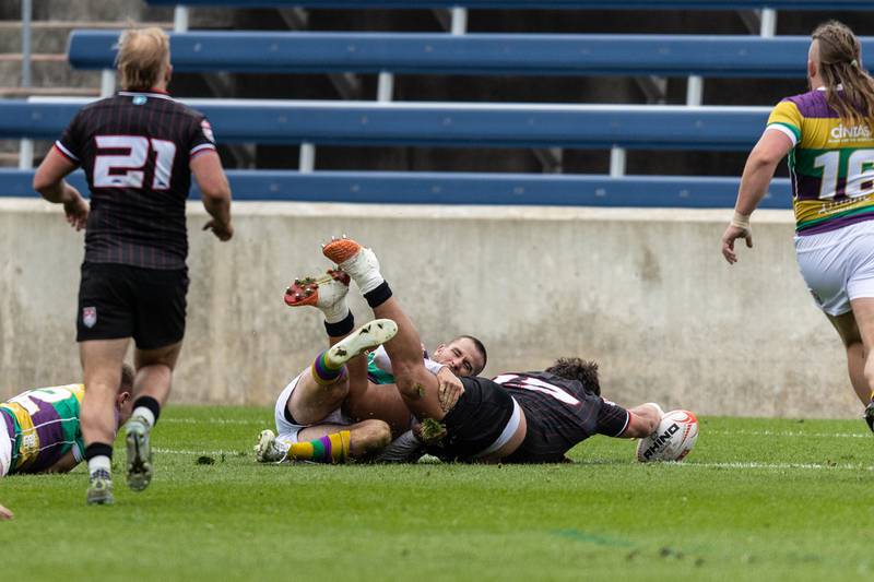 Chicago Hounds'  Fred Apulu, slams the ball down for a try against NOLA Gold at Seat Geek Stadium in Bridgeview, on Sunday April 23, 2023.