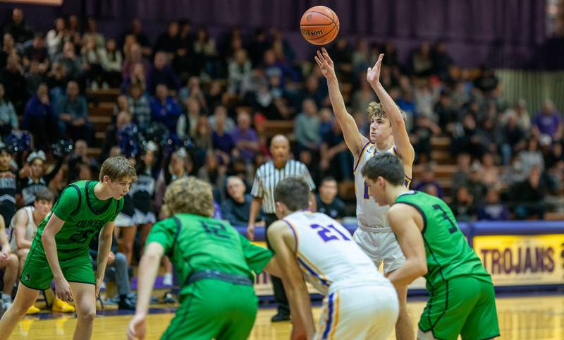Downers Grove North's Maxwell Haack (14) shoots a free-throw late in the 4th quarter of play against York during a basketball game at Downers Grove North High School on Friday, Dec 9, 2022.