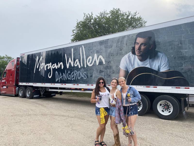 Alexa Duenas, Jessica Ochoa and Brea Jereb pose in front of Morgan Wallen's tour truck on Saturday, July 23, at Country Thunder in Twin Lakes, Wisconsin.