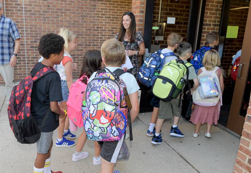 Students arrive at Louise White Elementary School in Batavia for the first day of classes on Wednesday, Aug 14, 2025.