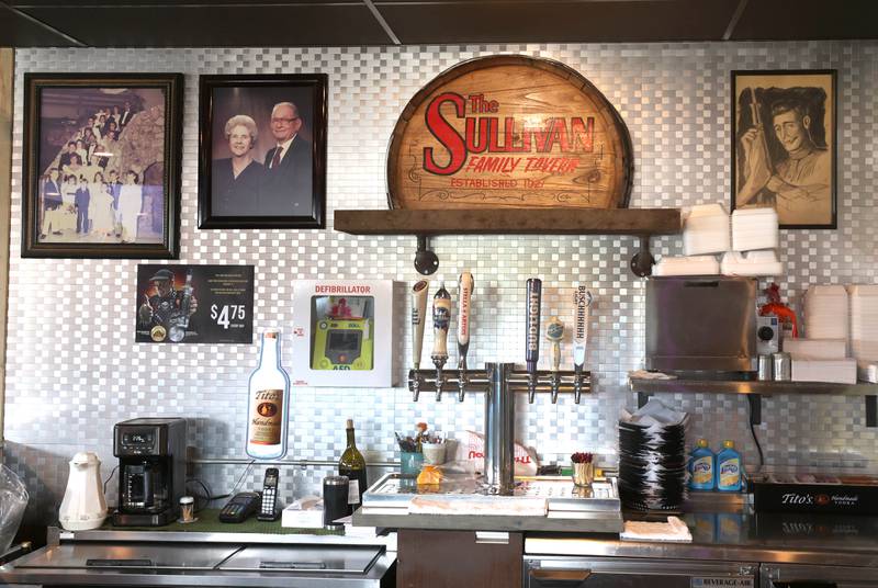Portions of the Sullivan's Tavern in DeKalb are adorned with family photos and bar history. The tavern is celebrating 80 years in business with an event Saturday, May 17, that will include food and live entertainment.