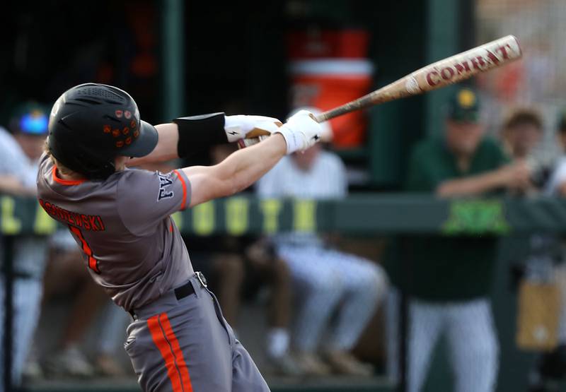McHenry's Kaden Wasniewski hits a two-run home run during a Fox Valley Conference baseball game against Crystal Lake South on Monday, April 13, 2026, at Crystal Lake South High School.