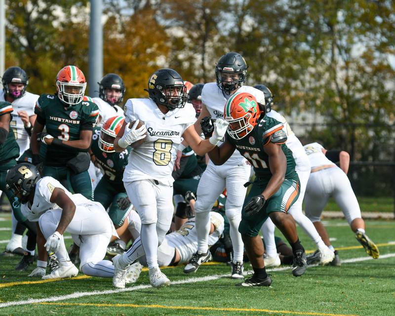 Sycamore’s Diego Garcia (8) walks into the endzone on a two point conversion during the second quarter on Saturday Nov. 4, 2023, while taking on Morgan Park at Gately Stadium in Chicago.