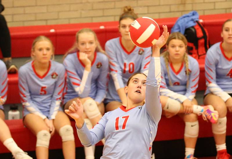 Ottawa's Olivia Evola returns a serve from Sycamore on Thursday, Oct. 12, 2023 at Kingman Gym.