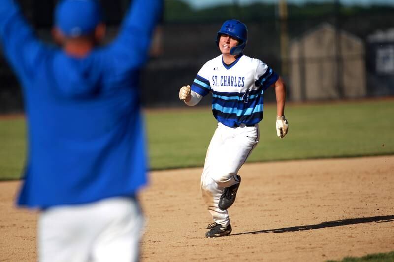 St. Charles North’s Ty Heimbuch runs to third base during a Class 4A St. Charles North Sectional semifinal game against South Elgin on Wednesday, May 29, 2024.