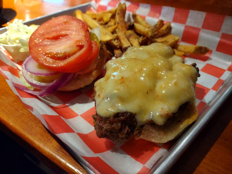 The Garage Fire burger serves a spicy blend of toppings at No. 4 Social Garage in Seneca. The burger patty is topped with three types of hot peppers, spicy mayo and ghost pepper cheese.