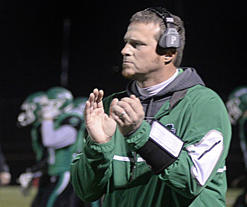 Seneca football head coach Terry Maxwell applauds his team during the Class 3A first round playoff game on Friday, Oct. 28, 2022 at Seneca.